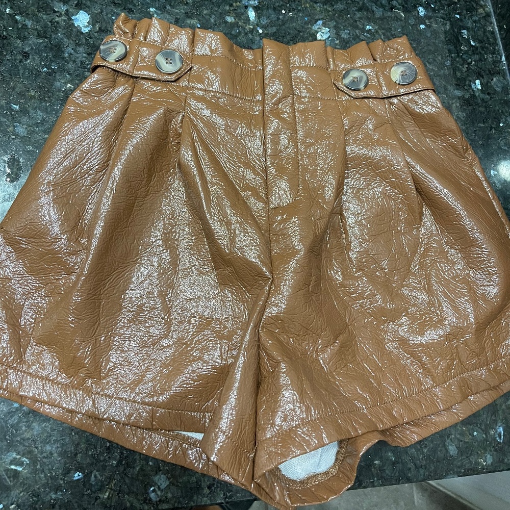 Brown patent leather shorts